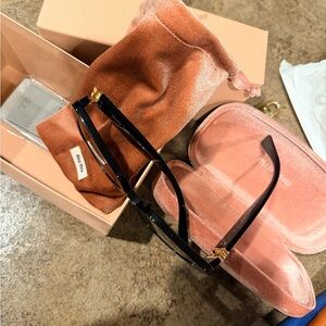 Miu Miu Black Sunglasses with Gold Details